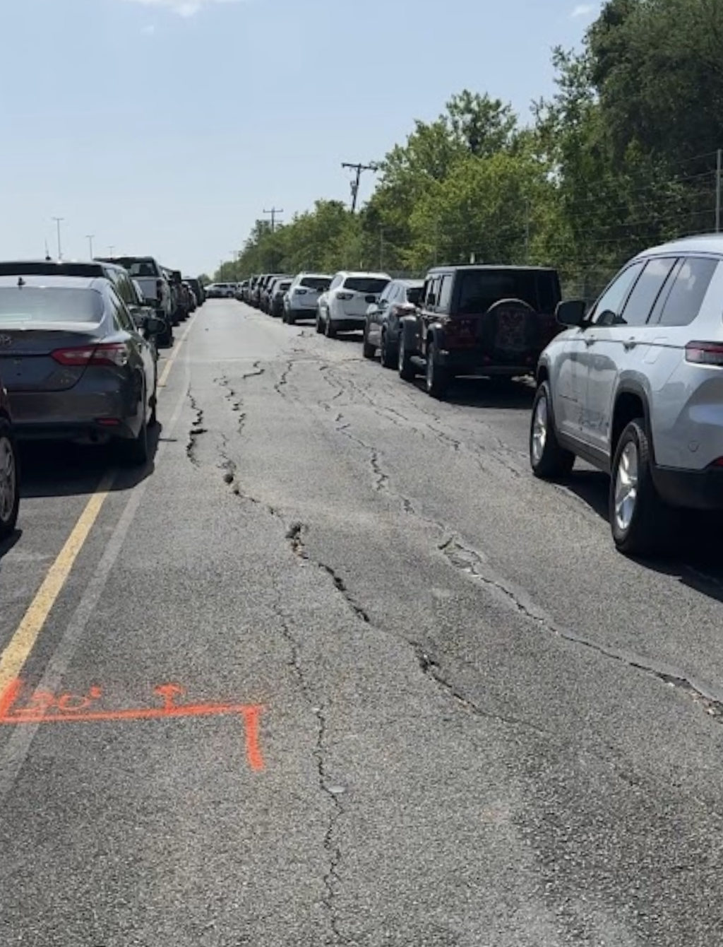Before - Damaged pavement with cracks and potholes